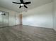 Bedroom featuring hardwood flooring, windows and a ceiling fan with closet at 1812 Ashborough Se Cir # C, Marietta, GA 30067