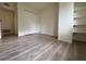 Bedroom featuring hardwood floors, a closet, and built-in shelving for optimal storage and organization at 1812 Ashborough Se Cir # C, Marietta, GA 30067