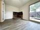 Versatile room with unique stone fireplace and sliding door to patio at 1812 Ashborough Se Cir # C, Marietta, GA 30067