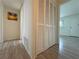 Hallway featuring louvered doors and new flooring at 1812 Ashborough Se Cir # C, Marietta, GA 30067