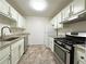 Well-lit kitchen with stainless steel appliances and granite countertops at 1812 Ashborough Se Cir # C, Marietta, GA 30067