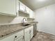 Modern kitchen with stainless steel appliances and ample countertop space at 1812 Ashborough Se Cir # C, Marietta, GA 30067