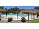 Community pool surrounded by a secure fence and lush landscaping, perfect for relaxation and recreation at 1812 Ashborough Se Cir # C, Marietta, GA 30067