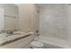 Bathroom featuring modern vanity with granite countertop and tiled shower/tub combo at 2212 Chestnut Log Loop, Lithia Springs, GA 30122