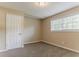 A tranquil bedroom is enhanced by natural light and fresh, neutral paint at 2212 Chestnut Log Loop, Lithia Springs, GA 30122