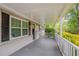 A cozy front porch offers an inviting outdoor space to relax at 2212 Chestnut Log Loop, Lithia Springs, GA 30122
