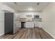 Well-lit kitchen featuring a stainless steel refrigerator and sleek countertops at 2212 Chestnut Log Loop, Lithia Springs, GA 30122