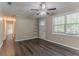 Bright living area showcasing wood-look flooring and an inviting atmosphere at 2212 Chestnut Log Loop, Lithia Springs, GA 30122
