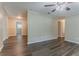 Open-concept living room showcasing hardwood floors and neutral wall paint at 2212 Chestnut Log Loop, Lithia Springs, GA 30122