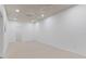Finished basement space with neutral carpet, ceiling and walls at 4978 Thornwood Nw Cv, Acworth, GA 30102