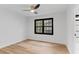 Bright bedroom with hardwood floors and a large window, creating a serene atmosphere at 4978 Thornwood Nw Cv, Acworth, GA 30102