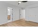 Comfortable bedroom with hardwood floors, closet, and a door to the bathroom at 4978 Thornwood Nw Cv, Acworth, GA 30102