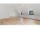 Large bonus room featuring hardwood floors and natural light at 4978 Thornwood Nw Cv, Acworth, GA 30102