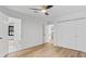 Spacious bedroom features light hardwood floors, closet, and access to bathroom at 4978 Thornwood Nw Cv, Acworth, GA 30102