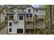 Back exterior of home with deck on multiple levels and garage at 4978 Thornwood Nw Cv, Acworth, GA 30102