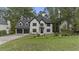 Beautiful two-story home featuring a two-car garage, lush lawn, and mature trees at 4978 Thornwood Nw Cv, Acworth, GA 30102