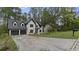 Lovely two-story house with a driveway, a black mailbox and mature trees in the background at 4978 Thornwood Nw Cv, Acworth, GA 30102