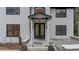Inviting front porch featuring a covered entry and a decorative glass front door at 4978 Thornwood Nw Cv, Acworth, GA 30102