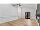 Spacious living room with hardwood floors, fireplace, and large windows, offering ample natural light at 4978 Thornwood Nw Cv, Acworth, GA 30102