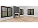 Elegant living room with hardwood floors and a cozy fireplace, perfect for relaxation at 4978 Thornwood Nw Cv, Acworth, GA 30102