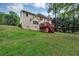 Grassy backyard features a large deck, perfect for outdoor activities and enjoying nature at 509 Orchards Walk, Stone Mountain, GA 30087