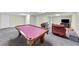 Spacious basement features a pool table, comfortable seating, and plenty of room for entertainment at 509 Orchards Walk, Stone Mountain, GA 30087