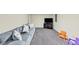 Comfortable basement seating includes plush sofa, flat-screen TV, and room for Gathering time at 509 Orchards Walk, Stone Mountain, GA 30087