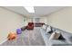 Basement with pool table, sofa, comfortable armchair, and plenty of entertainment space at 509 Orchards Walk, Stone Mountain, GA 30087
