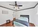 Inviting bedroom featuring wood floors, a ceiling fan, and a comfortable bed for a peaceful night's sleep at 509 Orchards Walk, Stone Mountain, GA 30087