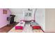 View of twin beds and an exercise machine in a bedroom with a ceiling fan and bright, open feel at 509 Orchards Walk, Stone Mountain, GA 30087