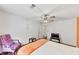 Bright bedroom featuring a ceiling fan, wood floors, and charming decor for a cozy and inviting space at 509 Orchards Walk, Stone Mountain, GA 30087