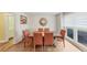 Inviting dining room featuring wood floors, natural light, and seating for six at 509 Orchards Walk, Stone Mountain, GA 30087