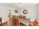 Elegant dining area with wood floors, modern lighting and seating for six at 509 Orchards Walk, Stone Mountain, GA 30087
