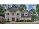 Charming two-story home with landscaped yard and inviting curb appeal on a treed lot at 509 Orchards Walk, Stone Mountain, GA 30087