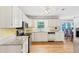 Well-lit kitchen features white cabinets, stainless steel appliances, granite countertops and hardwood floors at 509 Orchards Walk, Stone Mountain, GA 30087