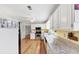 Bright kitchen features white cabinetry, stainless steel appliances, and lovely granite countertops at 509 Orchards Walk, Stone Mountain, GA 30087