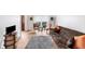 Cozy living room features hardwood floors, comfortable seating, and natural light from the window overlooking the outdoors at 509 Orchards Walk, Stone Mountain, GA 30087