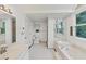 Large main bathroom with dual sinks, jacuzzi tub, and walk in shower at 509 Orchards Walk, Stone Mountain, GA 30087