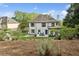 Landscaped backyard featuring a charming playhouse and serene outdoor space at 230 Bluff Oak Dr, Roswell, GA 30076