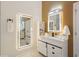 Well-lit bathroom featuring backlit mirrors, modern vanity, and marble-style tiled shower at 230 Bluff Oak Dr, Roswell, GA 30076