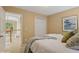 Comfortable bedroom featuring tan colored walls, access to an upstairs hall and a plush bed at 230 Bluff Oak Dr, Roswell, GA 30076