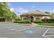 Community clubhouse featuring accessible parking, manicured landscaping, and well-maintained exterior at 230 Bluff Oak Dr, Roswell, GA 30076