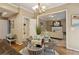 Charming dining area connects to a bright living room and a well-organized pantry with shelving at 230 Bluff Oak Dr, Roswell, GA 30076
