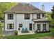 Exterior of the home showcasing a well-maintained backyard and black-trimmed windows at 230 Bluff Oak Dr, Roswell, GA 30076
