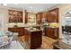 Well-lit kitchen featuring custom wood cabinets, stainless steel appliances, and a center island at 230 Bluff Oak Dr, Roswell, GA 30076