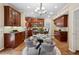 Bright kitchen with stainless steel appliances, wood cabinetry, and a functional eat-in dining space at 230 Bluff Oak Dr, Roswell, GA 30076
