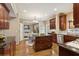 Well-equipped kitchen with an island, stainless steel appliances, granite countertops, and ample cabinet space at 230 Bluff Oak Dr, Roswell, GA 30076