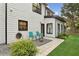 View of the tiled patio area outside the home's rear door featuring seating at 230 Bluff Oak Dr, Roswell, GA 30076