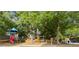Community playground featuring a colorful slide, climbing structures, and ride-on train for to play at 230 Bluff Oak Dr, Roswell, GA 30076