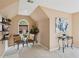 Cozy sitting area features floating shelves, decorative plants, and seating by an arched window at 230 Bluff Oak Dr, Roswell, GA 30076